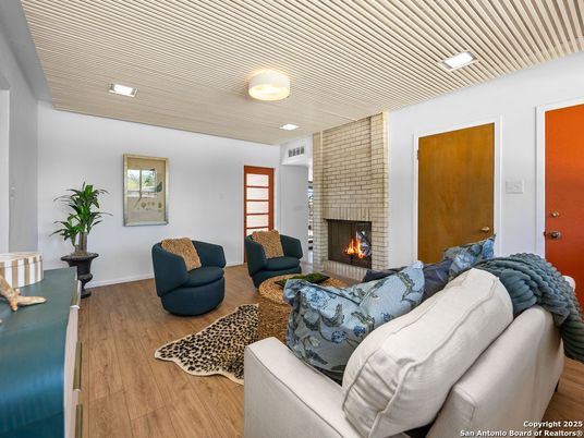 Fireplace, Interior, Living room, Recessed Lighting, Stone Walls, Wood Texture Flooring