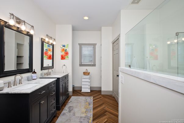 Bathroom, Dual Sink Vanities, Glass Shower, Interior, Recessed Lighting, Wood Texture Flooring