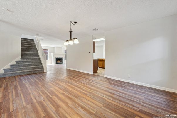 Empty room, Fireplace, Interior, Pendant Lights, Wood Texture Flooring