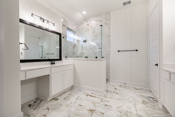 Bathroom, Dual Sink Vanities, Glass Shower, Interior, Marble, Marble Walls, Recessed Lighting