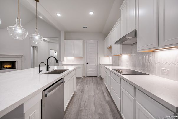 Fireplace, Interior, Kitchen, Pendant Lights, Recessed Lighting, Stainless Steel Appliances, Wood Texture Flooring