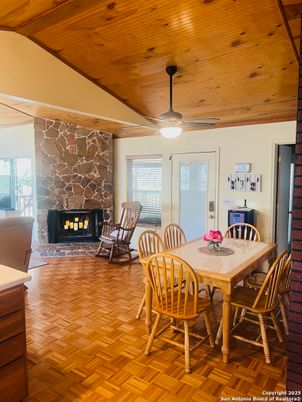Dining room, Fireplace, Interior, Stone Walls, Wooden Ceilings, Wood Texture Flooring