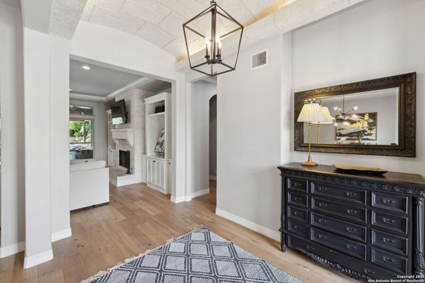 Fireplace, Interior, Pendant Lights, Recessed Lighting, Stone Walls, Wood Texture Flooring