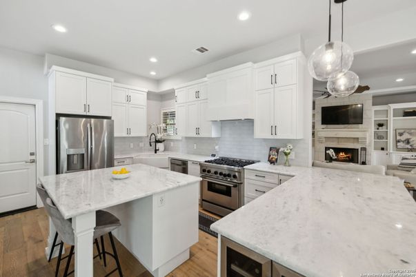 Fireplace, Interior, Kitchen, Pendant Lights, Recessed Lighting, Stainless Steel Appliances, Wood Texture Flooring