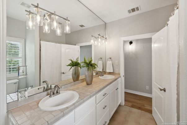 Bathroom, Dual Sink Vanities, Interior, Tile Countertops, Wood Texture Flooring