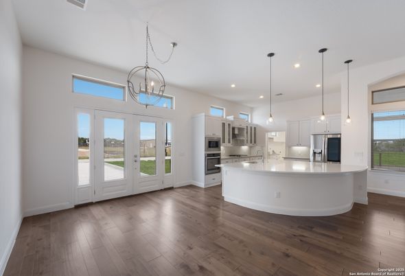 Chandelier, Interior, Kitchen, Pendant Lights, Recessed Lighting, Stainless Steel Appliances, Wood Texture Flooring