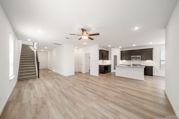 Empty room, Interior, Kitchen, Recessed Lighting, Stainless Steel Appliances, Wood Texture Flooring