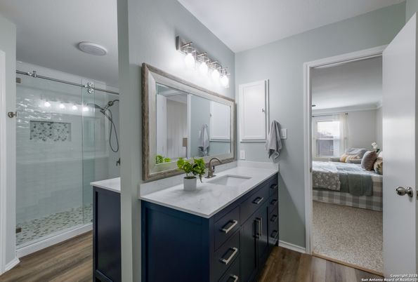 Bathroom, Bedroom, Dual Sink Vanities, Glass Shower, Interior, Wood Texture Flooring