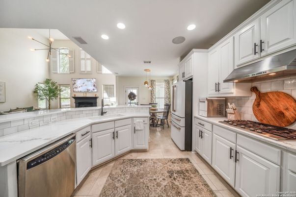 Dining room, Fireplace, Interior, Kitchen, Pendant Lights, Recessed Lighting, Stainless Steel Appliances