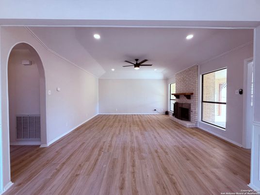 Empty room, Fireplace, Interior, Recessed Lighting, Stone Walls, Wood Texture Flooring
