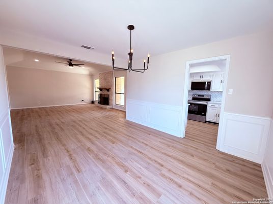 Chandelier, Empty room, Interior, Kitchen, Pendant Lights, Stainless Steel Appliances, Wood Texture Flooring