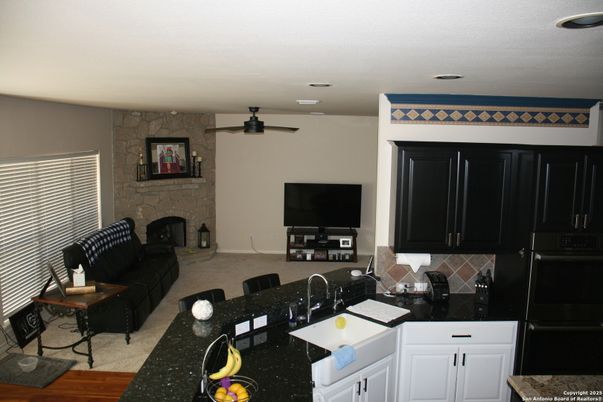 Fireplace, Interior, Kitchen, Living room, Recessed Lighting, Stone Walls, Wood Texture Flooring