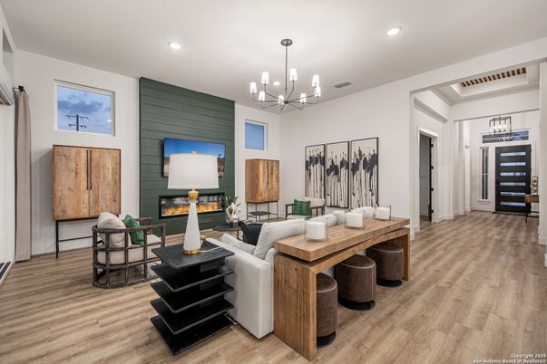 Chandelier, Fireplace, Interior, Living room, Pendant Lights, Recessed Lighting, Wood Texture Flooring