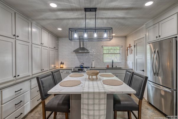 Dining room, Interior, Kitchen, Pendant Lights, Recessed Lighting, Stainless Steel Appliances, Stone Walls