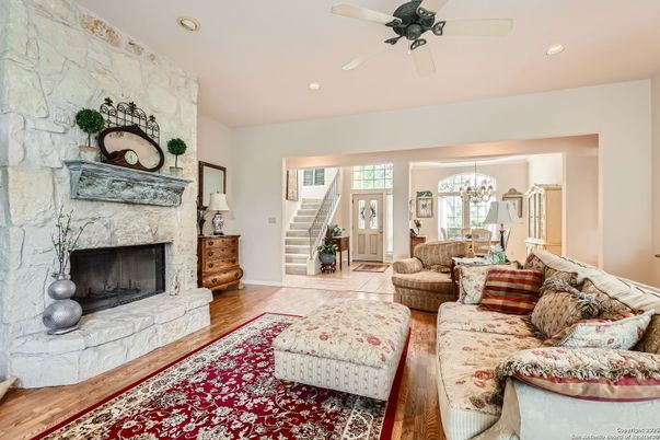 Fireplace, Interior, Living room, Recessed Lighting, Stone Walls, Wood Texture Flooring