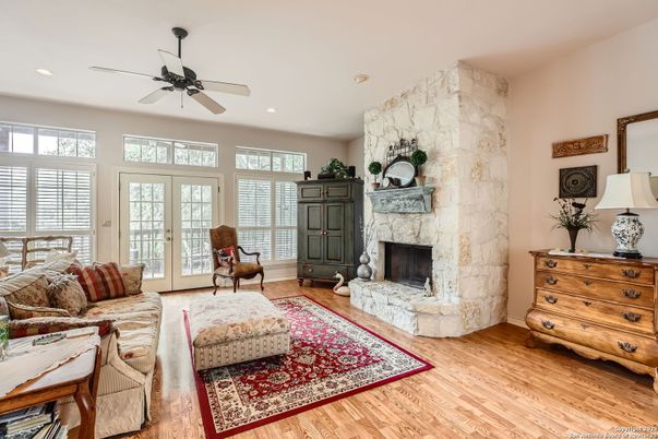 Fireplace, Interior, Living room, Recessed Lighting, Stone Walls, Wood Texture Flooring