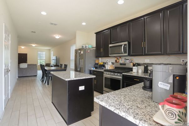 Dining room, Interior, Kitchen, Recessed Lighting, Stainless Steel Appliances, Wood Texture Flooring