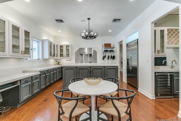 Chandelier, Dining room, Interior, Kitchen, Pendant Lights, Recessed Lighting, Stainless Steel Appliances, Wood Texture Flooring