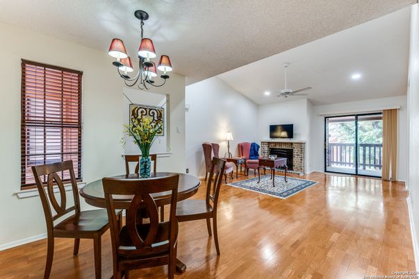 Chandelier, Dining room, Fireplace, Interior, Living room, Recessed Lighting, Wood Texture Flooring