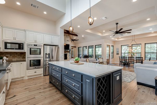 Dining room, Interior, Kitchen, Pendant Lights, Recessed Lighting, Stainless Steel Appliances, Wood Texture Flooring