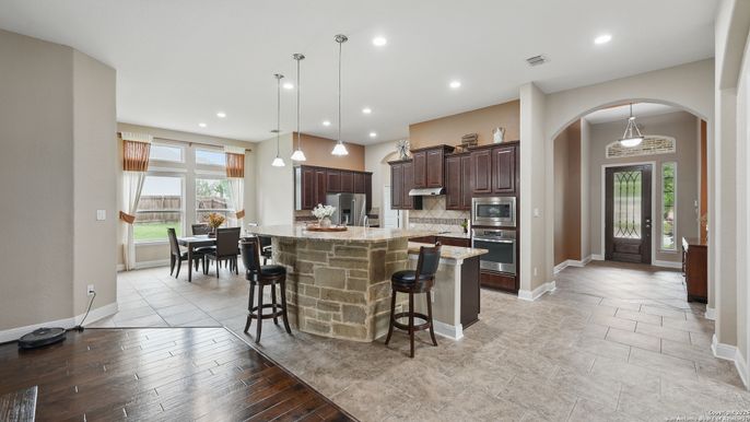 Dining room, Interior, Kitchen, Pendant Lights, Recessed Lighting, Stainless Steel Appliances, Wood Texture Flooring