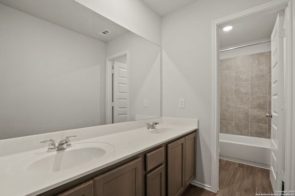 Bathroom, Dual Sink Vanities, Interior, Recessed Lighting, Wood Texture Flooring