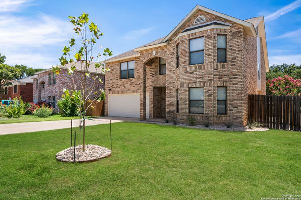 Attached, Backyard, Exterior, Facade, Brick Facade, Brick Traditional