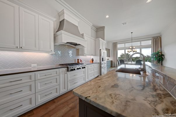Chandelier, Interior, Kitchen, Pendant Lights, Recessed Lighting, Stainless Steel Appliances, Wood Texture Flooring