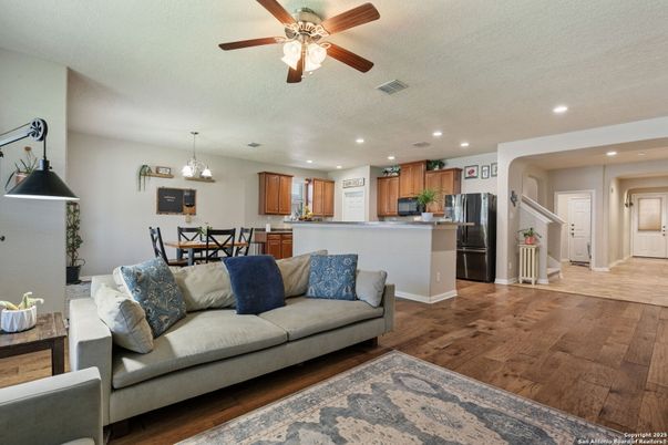Chandelier, Dining room, Interior, Kitchen, Living room, Pendant Lights, Recessed Lighting, Stainless Steel Appliances, Wood Texture Flooring