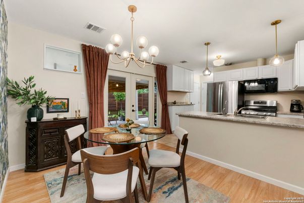 Chandelier, Dining room, Interior, Kitchen, Pendant Lights, Stainless Steel Appliances, Wood Texture Flooring