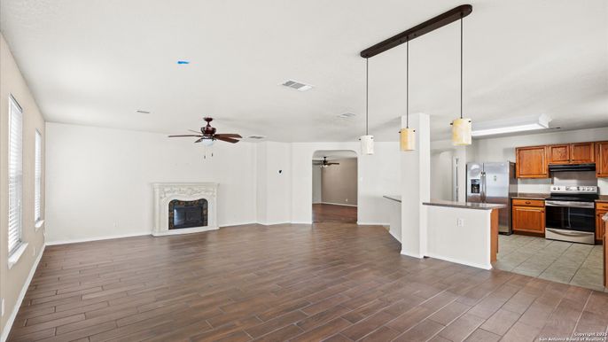 Empty room, Fireplace, Interior, Kitchen, Pendant Lights, Wood Texture Flooring