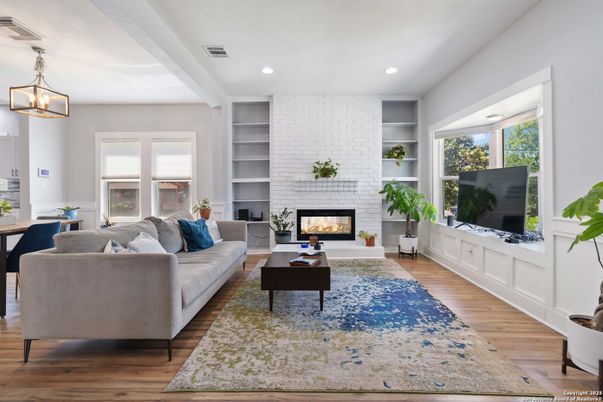 Fireplace, Interior, Living room, Pendant Lights, Recessed Lighting, Stone Walls, Wood Texture Flooring