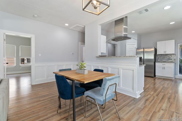 Dining room, Interior, Kitchen, Recessed Lighting, Stainless Steel Appliances, Wood Texture Flooring