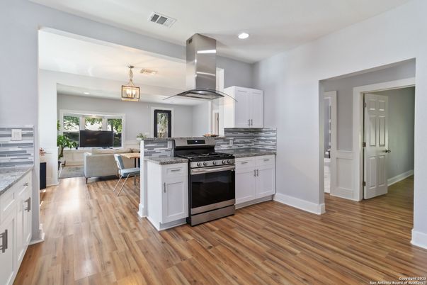 Dining room, Interior, Kitchen, Pendant Lights, Recessed Lighting, Stainless Steel Appliances, Wood Texture Flooring