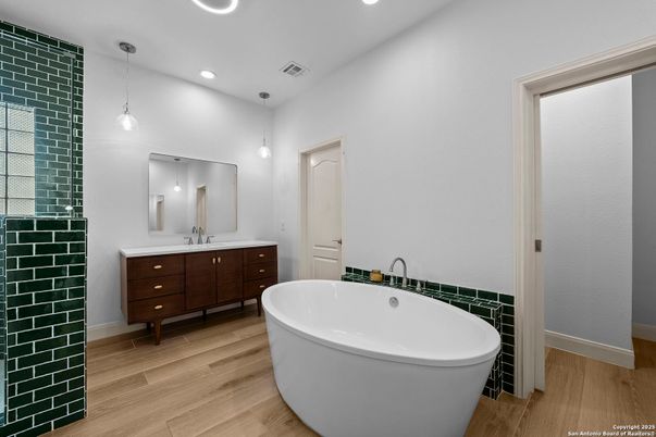 Bathroom, Dual Sink Vanities, Free Standing Baths, Interior, Pendant Lights, Recessed Lighting, Wood Texture Flooring