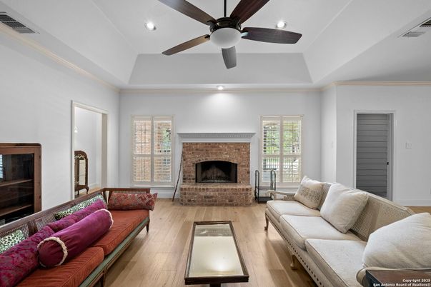 Fireplace, Interior, Living room, Recessed Lighting, Stone Walls, Wood Texture Flooring