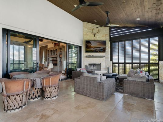 Dining room, Fireplace, Interior, Living room, Recessed Lighting, Stone Walls, Wooden Ceilings