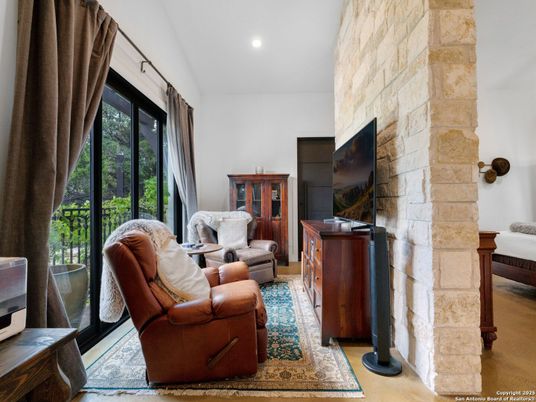 Fireplace, Interior, Living room, Recessed Lighting, Stone Walls, Wood Texture Flooring