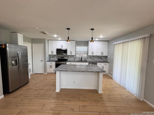 Interior, Kitchen, Pendant Lights, Recessed Lighting, Stainless Steel Appliances, Wood Texture Flooring