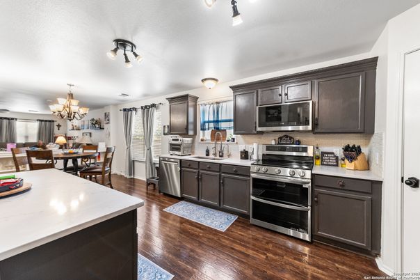 Chandelier, Dining room, Interior, Kitchen, Stainless Steel Appliances, Wood Texture Flooring