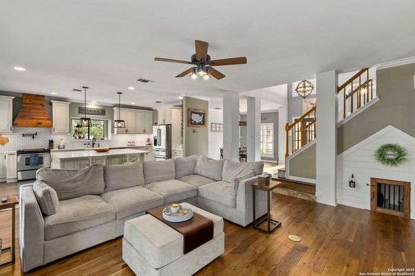 Fireplace, Interior, Kitchen, Living room, Pendant Lights, Recessed Lighting, Stainless Steel Appliances, Wood Texture Flooring