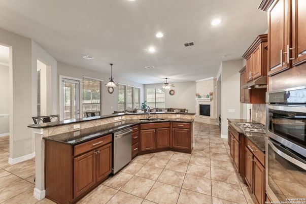 Fireplace, Interior, Kitchen, Pendant Lights, Recessed Lighting, Stainless Steel Appliances