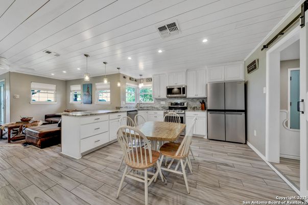 Dining room, Interior, Kitchen, Living room, Pendant Lights, Recessed Lighting, Stainless Steel Appliances, Wood Texture Flooring