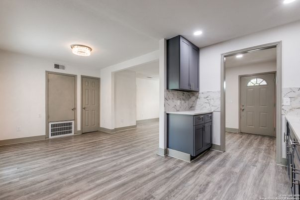 Interior, Kitchen, Marble Walls, Recessed Lighting, Wood Texture Flooring