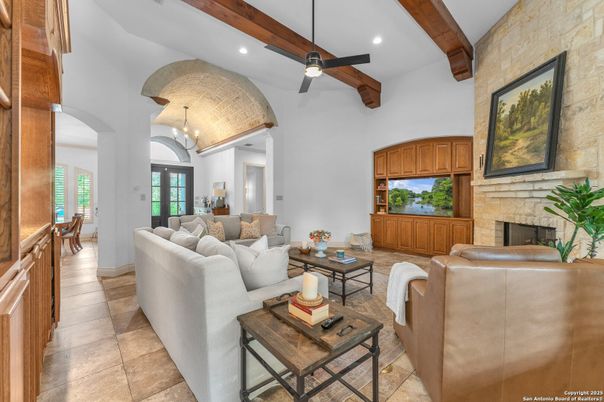 Chandelier, Fireplace, Interior, Living room, Recessed Lighting, Stone Walls, Wooden Beams