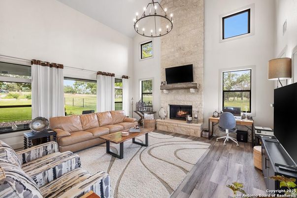 Fireplace, Home Office, Interior, Living room, Pendant Lights, Stone Walls, Wood Texture Flooring