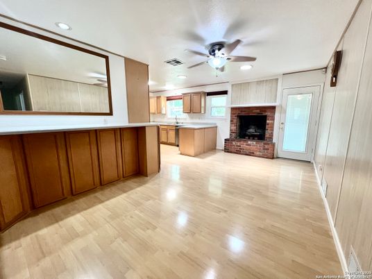 Empty room, Fireplace, Interior, Kitchen, Recessed Lighting, Wood Texture Flooring