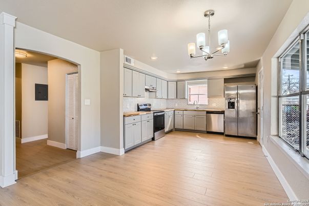 Chandelier, Interior, Kitchen, Pendant Lights, Recessed Lighting, Stainless Steel Appliances, Wood Texture Flooring