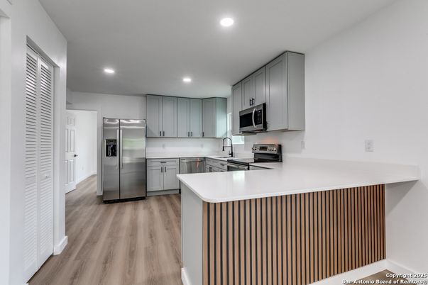 Interior, Kitchen, Recessed Lighting, Stainless Steel Appliances, Wood Texture Flooring