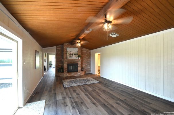 Empty room, Fireplace, Interior, Stone Walls, Wooden Ceilings, Wood Texture Flooring